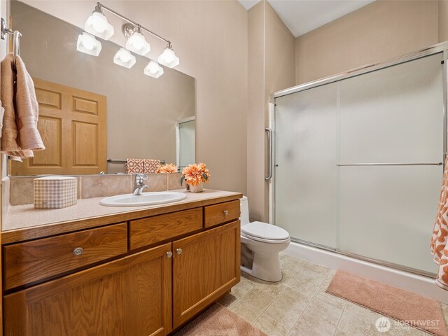28235 SE 268th St, Ravensdale, WA 98051 - bathroom featuring a shower stall, toilet, vanity, and tile patterned flooring
