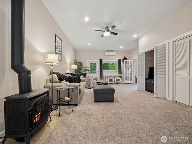 28235 SE 268th St, Ravensdale, WA 98051 - carpeted living room with a wood stove, ceiling fan, a wall unit AC, and recessed lighting