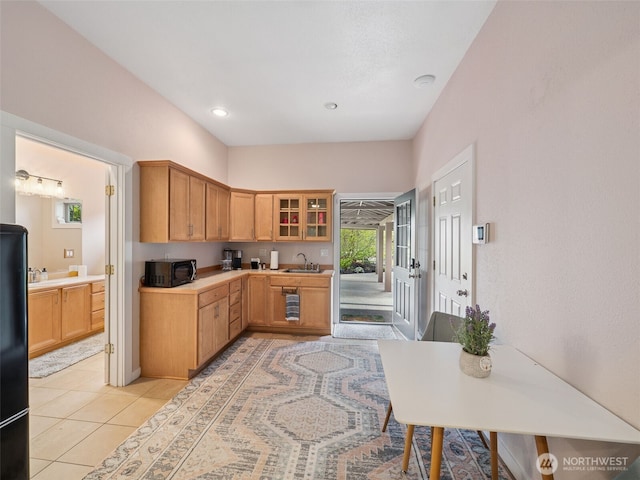 28235 SE 268th St, Ravensdale, WA 98051 - kitchen with a sink, glass insert cabinets, light countertops, and light tile patterned floors
