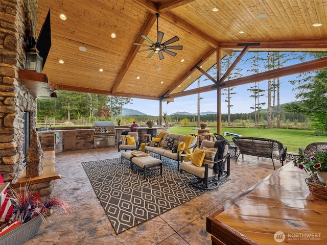28235 SE 268th St, Ravensdale, WA 98051 - view of patio with a mountain view, exterior kitchen, outdoor lounge area, a ceiling fan, and area for grilling
