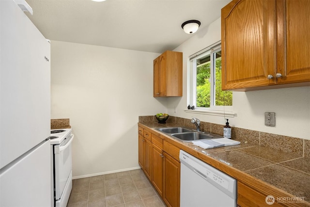 26692 Weaver Ave NW, Poulsbo, WA 98370 - kitchen with white appliances, a sink, tile counters, brown cabinets, and baseboards