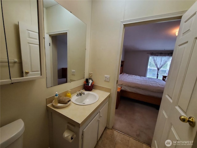 669 Duck Lake Dr NE, Ocean Shores, WA 98569 - ensuite bathroom with toilet, tile patterned flooring, and vanity