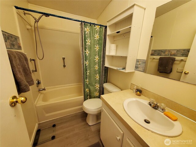 669 Duck Lake Dr NE, Ocean Shores, WA 98569 - full bath with wood finished floors, toilet, shower / bath combo with shower curtain, and vanity