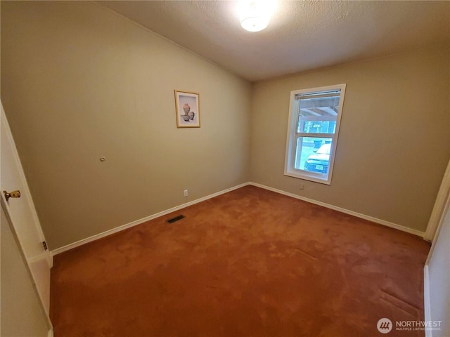 669 Duck Lake Dr NE, Ocean Shores, WA 98569 - spare room with carpet, lofted ceiling, baseboards, and a textured ceiling