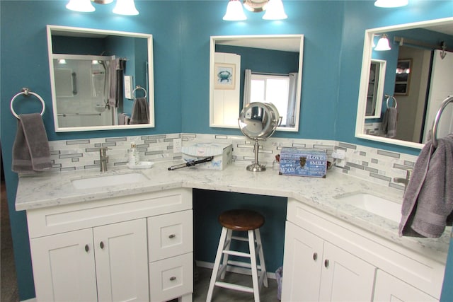 1427 100th St SW Unit 149, Everett, WA 98204 - bathroom with a stall shower, decorative backsplash, and double vanity