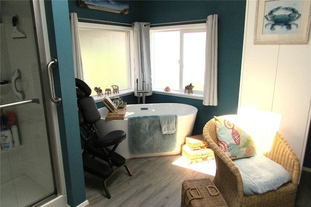1427 100th St SW Unit 149, Everett, WA 98204 - full bathroom with wood finished floors, a shower stall, and a freestanding bath