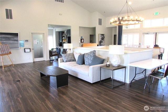 1427 100th St SW Unit 149, Everett, WA 98204 - living room with high vaulted ceiling, dark wood-style flooring, a chandelier, and baseboards