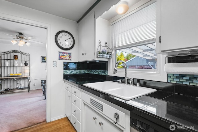 5502 N 21st St, Tacoma, WA 98406 - kitchen with a sink, white cabinets, a ceiling fan, light wood-type flooring, and tasteful backsplash