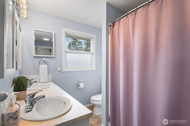 5502 N 21st St, Tacoma, WA 98406 - bathroom featuring toilet, double vanity, and tile patterned flooring