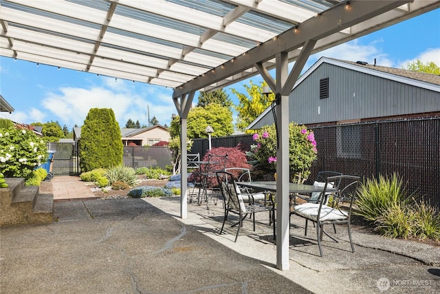 5502 N 21st St, Tacoma, WA 98406 - view of patio / terrace featuring a fenced backyard, outdoor dining space, a pergola, and a gate