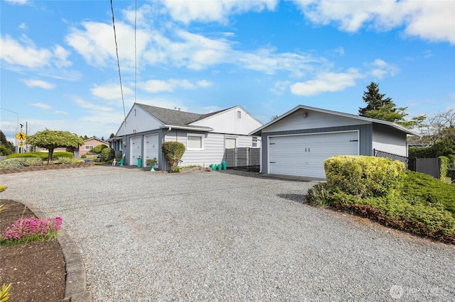 5502 N 21st St, Tacoma, WA 98406 - view of home's exterior featuring a garage, an outdoor structure, and fence