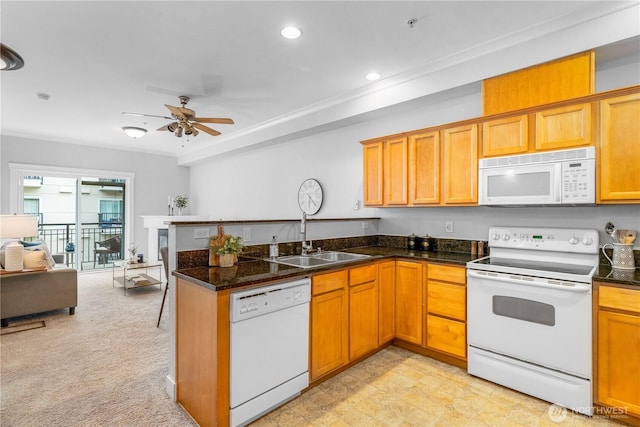 1015 Railroad Ave Unit 415, Bellingham, WA 98225 - kitchen featuring white appliances, a sink, a peninsula, open floor plan, and a ceiling fan