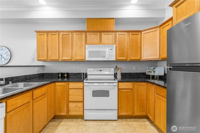 1015 Railroad Ave Unit 415, Bellingham, WA 98225 - kitchen featuring white appliances, a sink, dark stone countertops, and recessed lighting