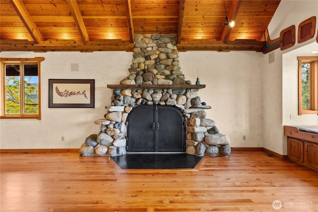 117 Vintin Rd, Carlton, WA 98814 - detailed view of wood ceiling, a stone fireplace, wood finished floors, beamed ceiling, and baseboards