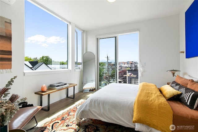 916NW 56th St Unit G, Seattle, WA 98107 - bedroom featuring wood finished floors and baseboards
