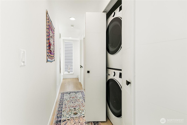 916NW 56th St Unit G, Seattle, WA 98107 - laundry area with stacked washer / drying machine, baseboards, recessed lighting, and light wood finished floors