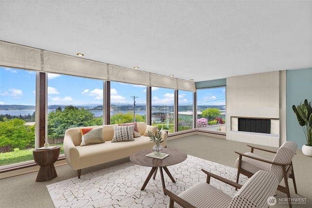 7618 19th St W, Tacoma, WA 98466 - carpeted living room with healthy amount of natural light and a water view