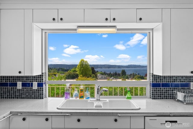 7618 19th St W, Tacoma, WA 98466 - kitchen with a sink, white dishwasher, and white cabinets