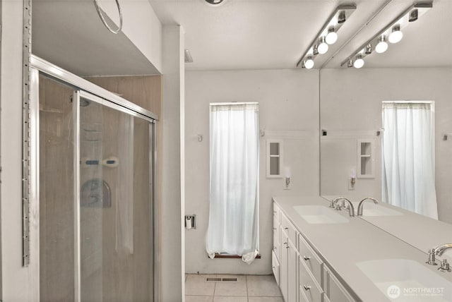7618 19th St W, Tacoma, WA 98466 - bathroom with a shower stall, tile patterned floors, and double vanity