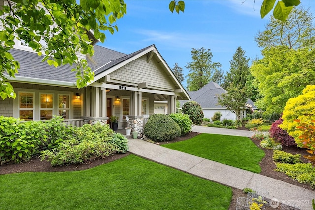 1241 Cherry Ave NE, Bainbridge Island, WA 98110 - craftsman-style house with a porch, roof with shingles, and a front yard