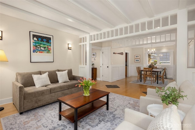 1241 Cherry Ave NE, Bainbridge Island, WA 98110 - living area featuring wood finished floors, a chandelier, and beam ceiling