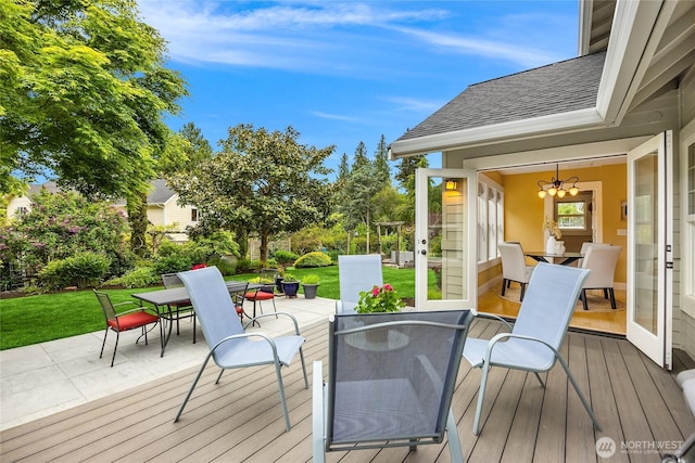 1241 Cherry Ave NE, Bainbridge Island, WA 98110 - wooden deck with outdoor dining space and a yard