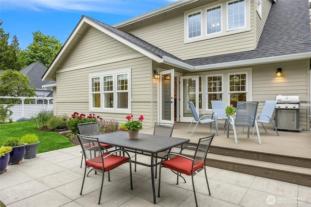 1241 Cherry Ave NE, Bainbridge Island, WA 98110 - view of patio with outdoor dining area, fence, grilling area, and a wooden deck
