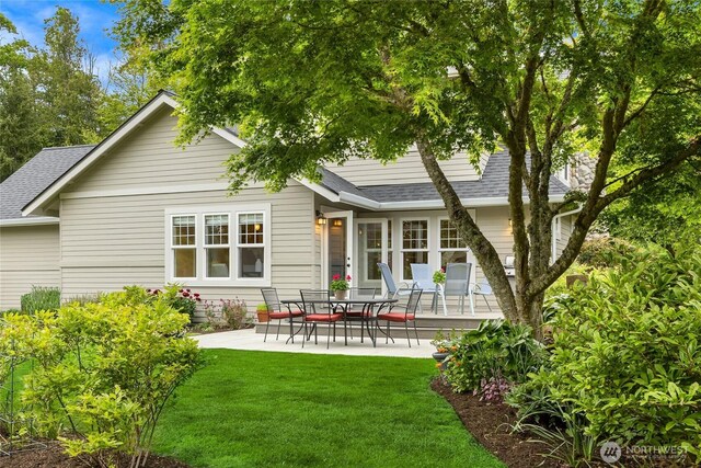 1241 Cherry Ave NE, Bainbridge Island, WA 98110 - rear view of house with roof with shingles, a patio area, and a yard