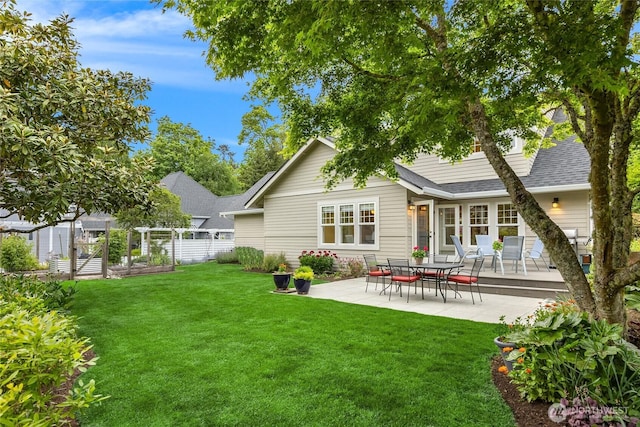 1241 Cherry Ave NE, Bainbridge Island, WA 98110 - rear view of property with a vegetable garden, a patio, and a shingled roof