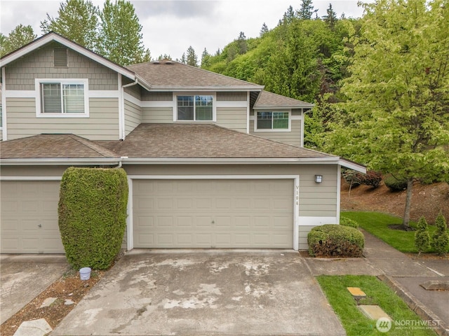 15150 140th Way SE Unit V104, Renton, WA 98058 - view of front of property featuring a shingled roof, driveway, and a garage