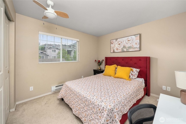 15150 140th Way SE Unit V104, Renton, WA 98058 - carpeted bedroom featuring a baseboard heating unit, baseboards, and a ceiling fan