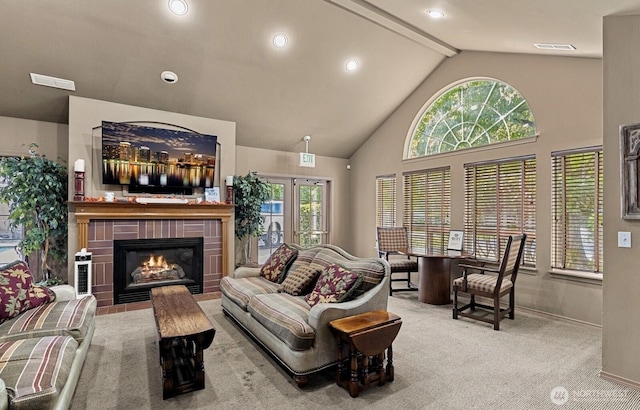 15150 140th Way SE Unit V104, Renton, WA 98058 - carpeted living room featuring healthy amount of natural light, a tile fireplace, beamed ceiling, high vaulted ceiling, and recessed lighting