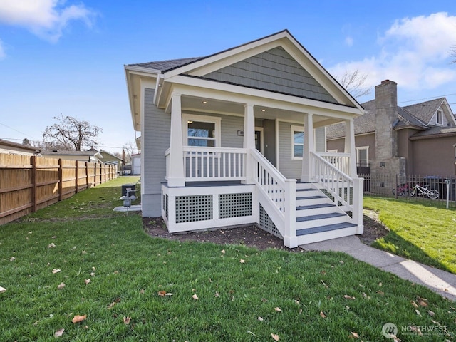 view of front of property featuring covered porch and stairs