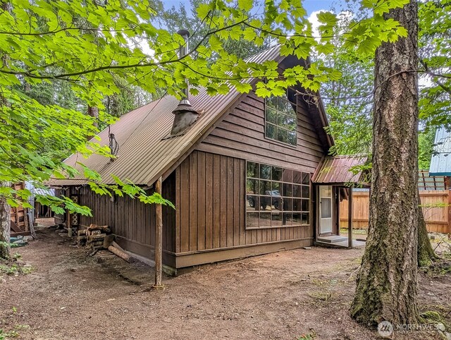 140 Sunstone Rd, Packwood, WA 98361 - view of side of home with metal roof and fence