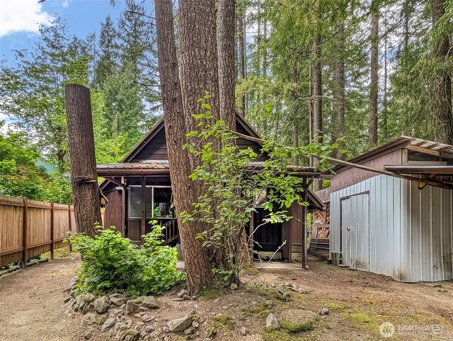 140 Sunstone Rd, Packwood, WA 98361 - rear view of house featuring fence, a shed, and an outdoor structure