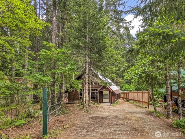 140 Sunstone Rd, Packwood, WA 98361 - view of front of property featuring fence, a view of trees, and an outdoor structure