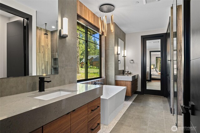 1591 Coal Mine Way, Cle Elum, WA 98922 - ensuite bathroom featuring two vanities, tile patterned flooring, and a shower
