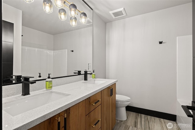1591 Coal Mine Way, Cle Elum, WA 98922 - full bathroom featuring toilet, double vanity, baseboards, and a shower
