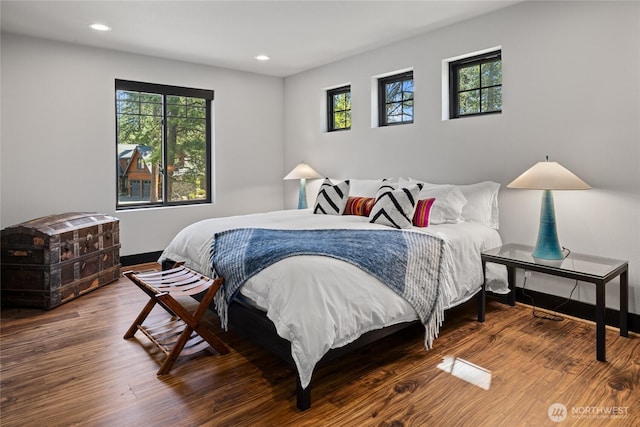 1591 Coal Mine Way, Cle Elum, WA 98922 - bedroom with multiple windows, wood finished floors, baseboards, and recessed lighting