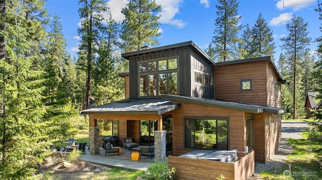 1591 Coal Mine Way, Cle Elum, WA 98922 - rear view of property featuring metal roof, a standing seam roof, and a patio