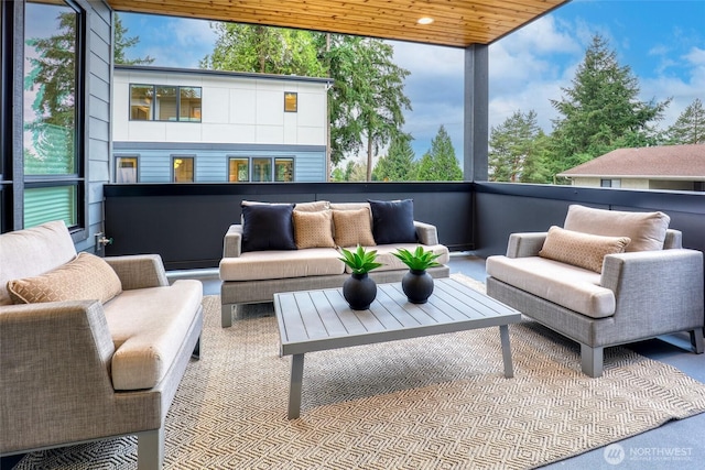 view of patio featuring outdoor lounge area and a balcony