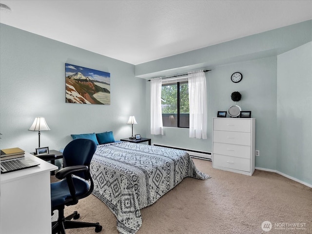 3024 NE 143rd St Unit 304, Seattle, WA 98125 - carpeted bedroom with baseboard heating, baseboards, and a desk