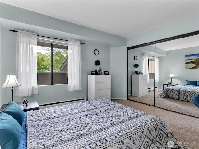 3024 NE 143rd St Unit 304, Seattle, WA 98125 - carpeted bedroom with a baseboard radiator and a closet