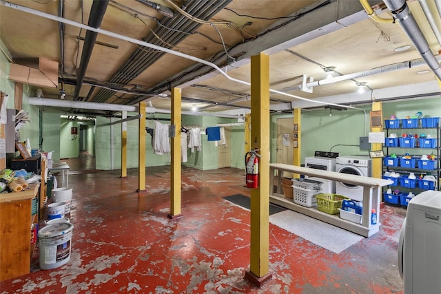 unfinished basement with washing machine and dryer