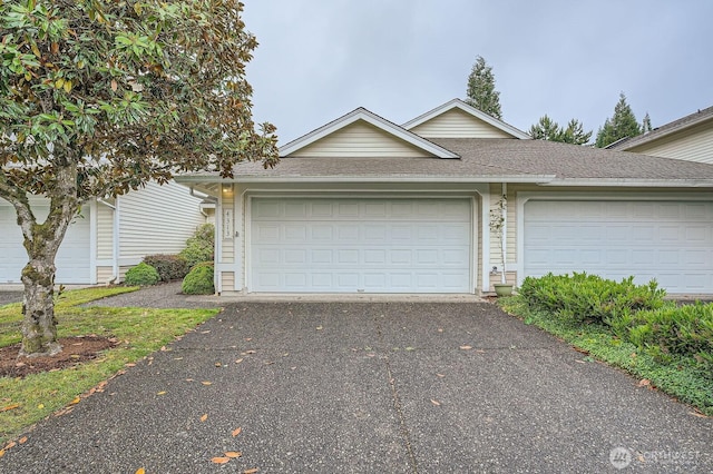 4313 S 220th Pl Unit 18-2, Kent, WA 98032 - view of front of house with roof with shingles