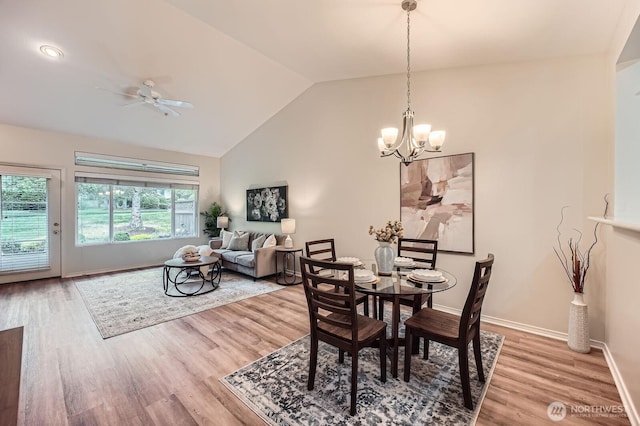 4313 S 220th Pl Unit 18-2, Kent, WA 98032 - dining space with lofted ceiling, light wood-style flooring, a chandelier, ceiling fan, and baseboards