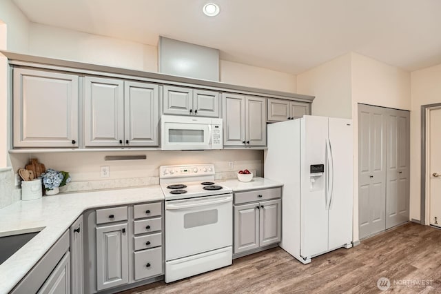 4313 S 220th Pl Unit 18-2, Kent, WA 98032 - kitchen with white appliances, gray cabinetry, light wood-style floors, and recessed lighting