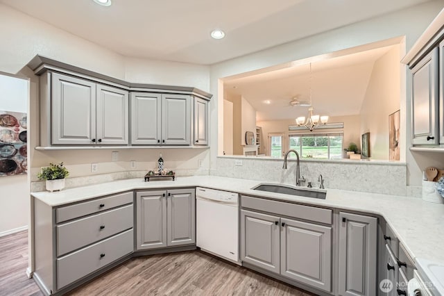 4313 S 220th Pl Unit 18-2, Kent, WA 98032 - kitchen featuring white dishwasher, gray cabinets, a sink, recessed lighting, and vaulted ceiling
