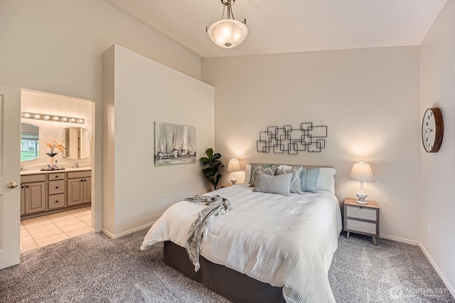 4313 S 220th Pl Unit 18-2, Kent, WA 98032 - bedroom with light colored carpet, ensuite bath, baseboards, and a sink