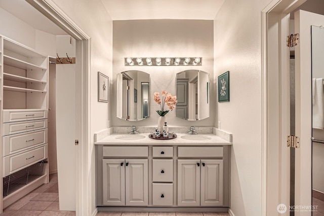 4313 S 220th Pl Unit 18-2, Kent, WA 98032 - bathroom with double vanity, tile patterned flooring, and baseboards